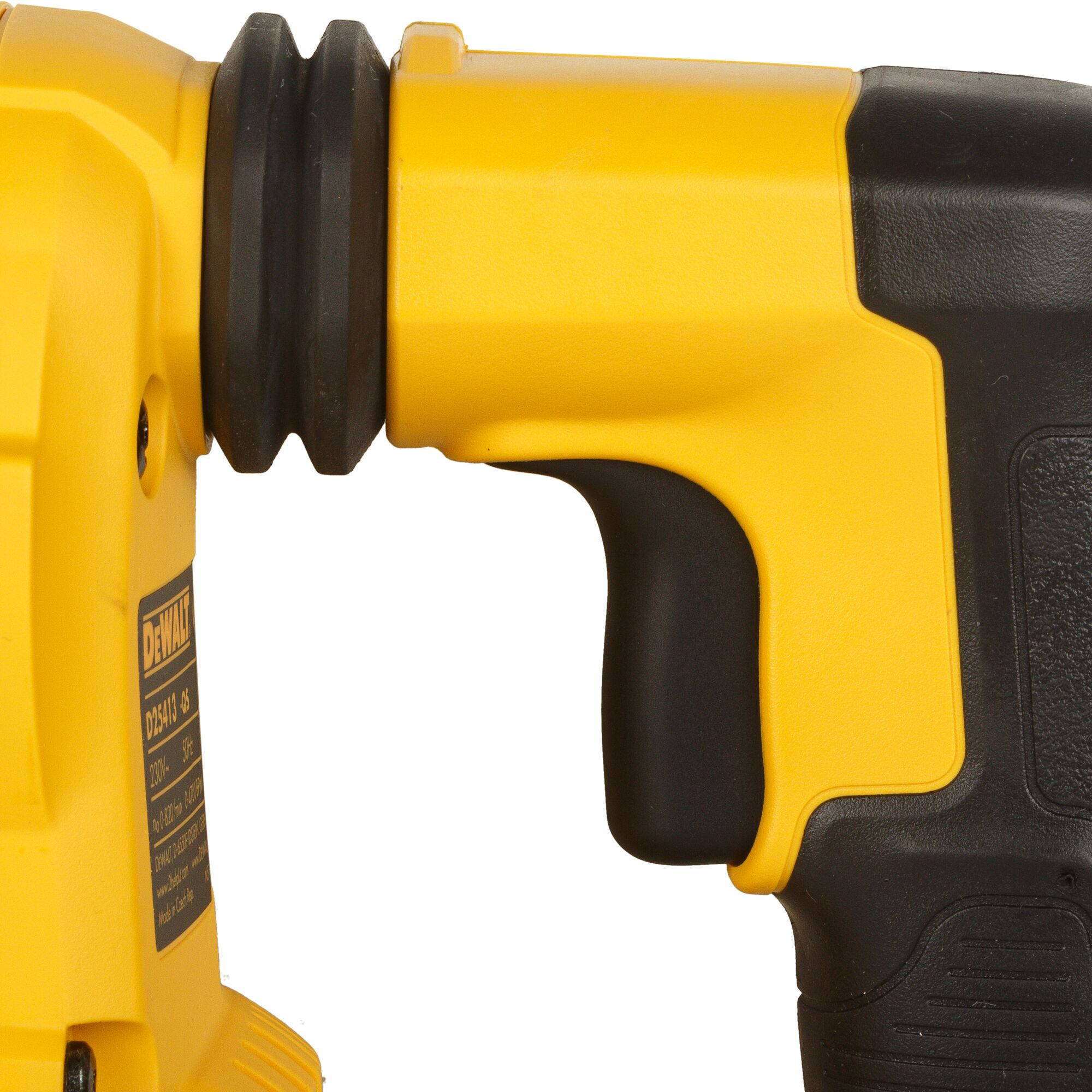 Close-up view of the handle and body of a yellow and black DEWALT power tool, showing part of the label and textured grip.