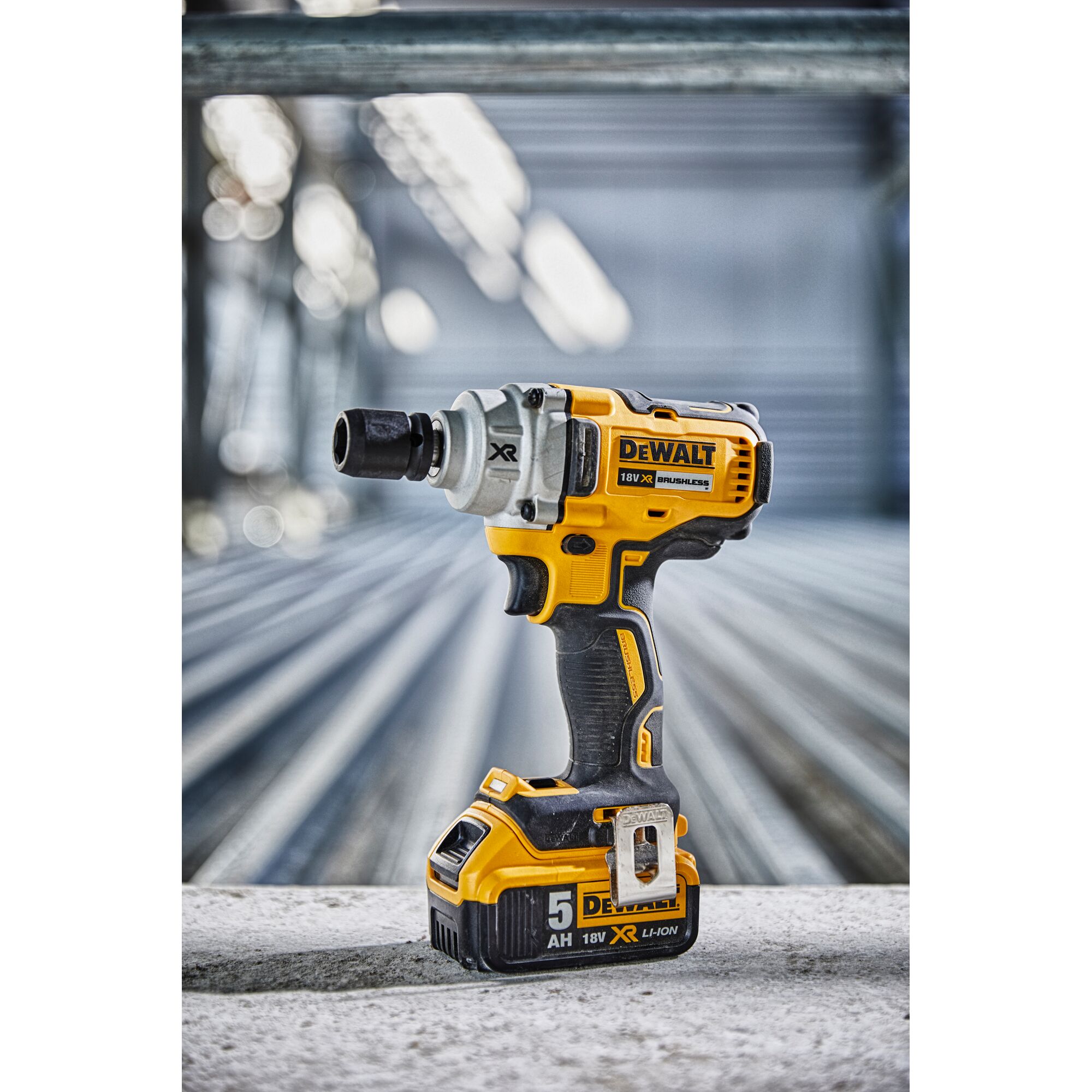 DEWALT DCF894N cordless impact wrench with 18V battery shown on an industrial surface.