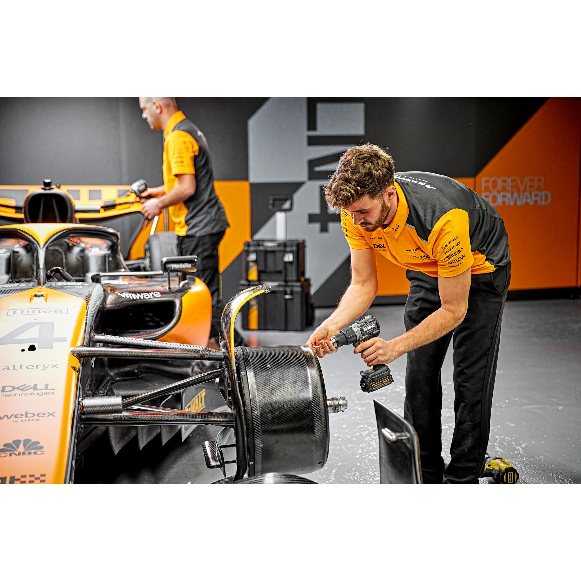 Limited Editon DEWALT/McLaren Drill Driver being used by pit crew on a McLaren F1 car