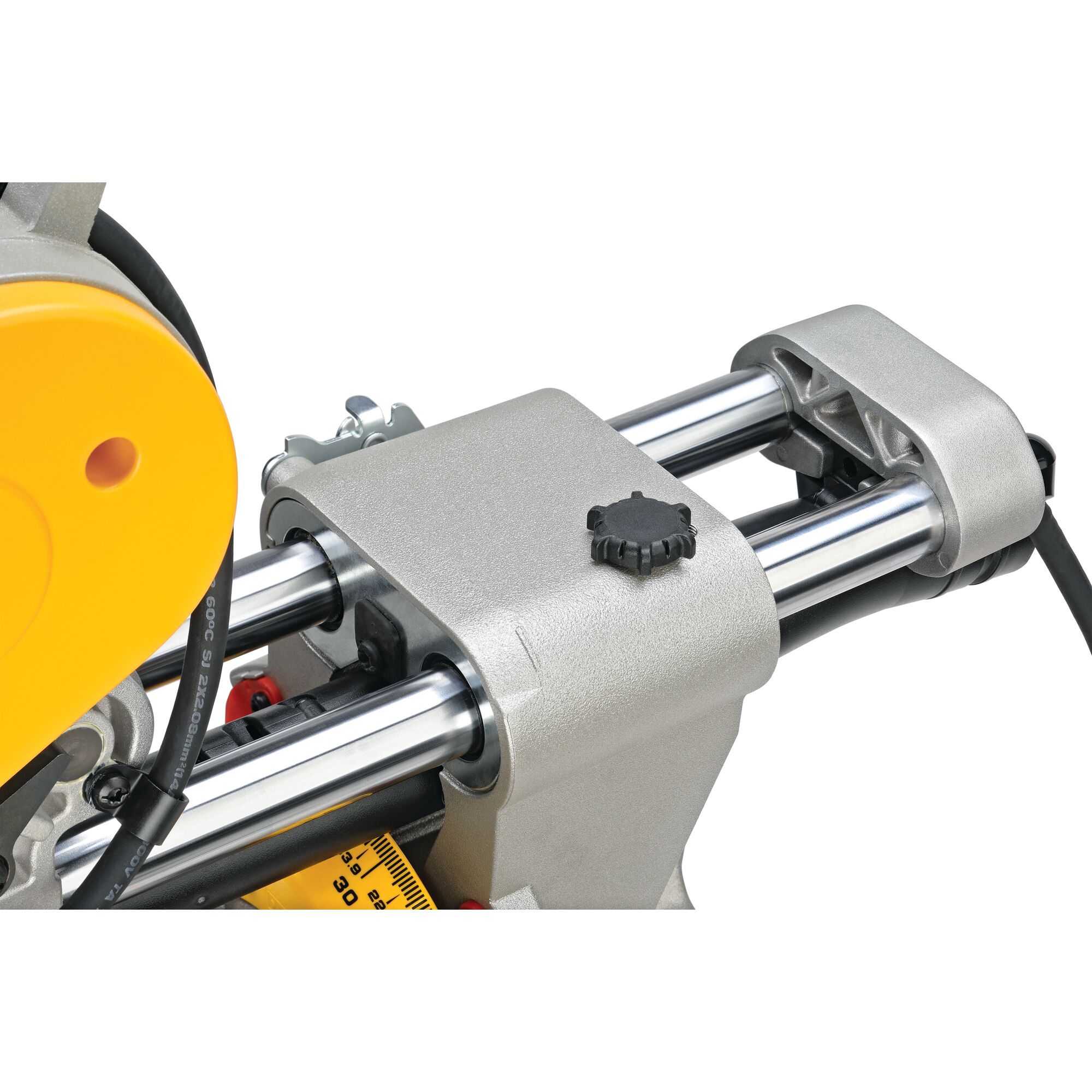 Close-up view of the sliding mechanism and adjustment knob on a DEWALT DWS780 miter saw, showing metal rails and part of the yellow housing.
