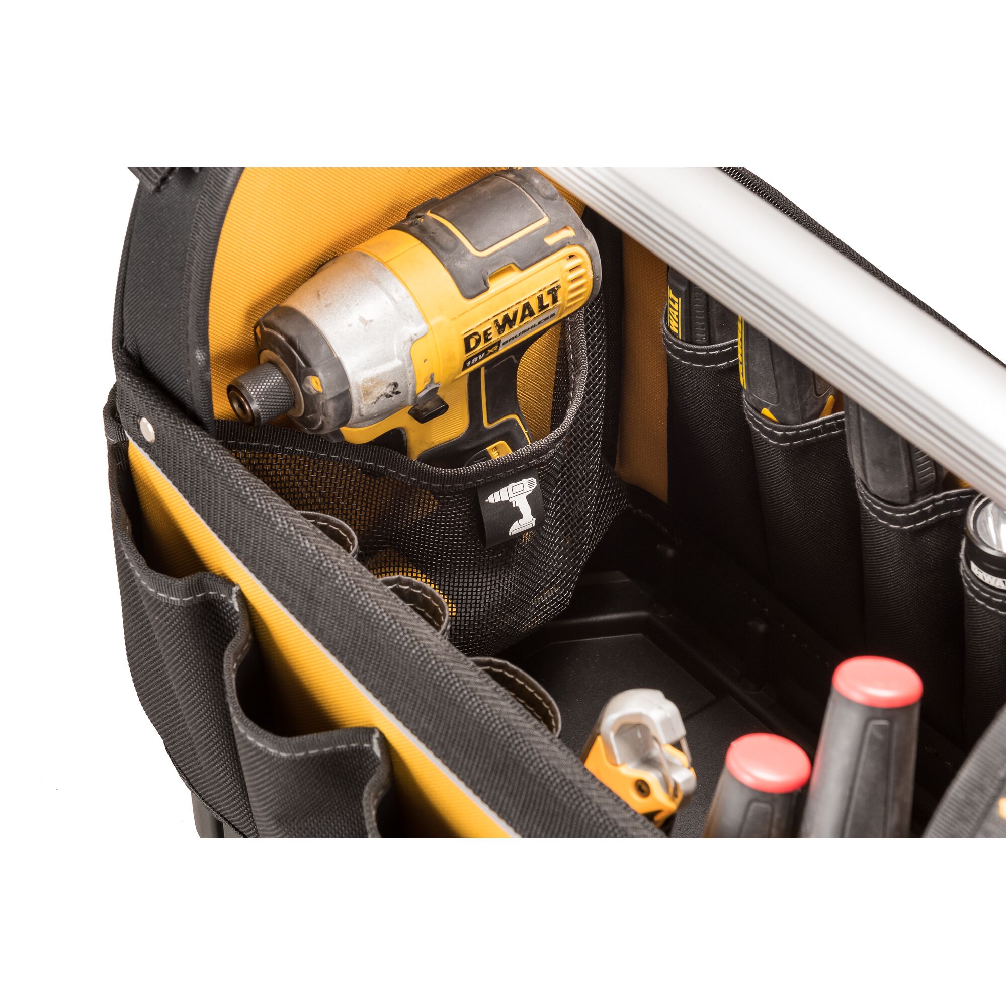 Close-up of a DEWALT-branded drill placed in a black and yellow tool bag with multiple compartments holding various tools.