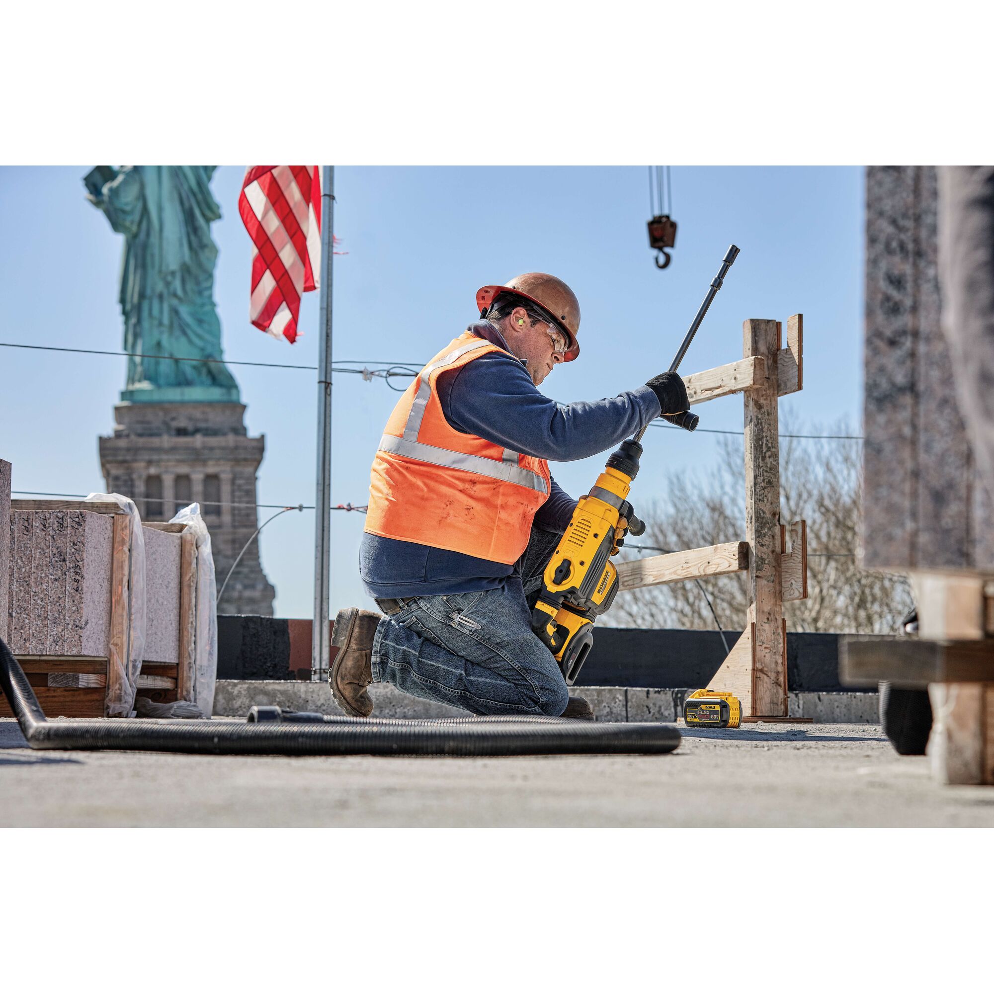 20 Volt to 60 Volt 12 AMP hours Lithium Ion Battery being replaced into a road drill by a construction worker