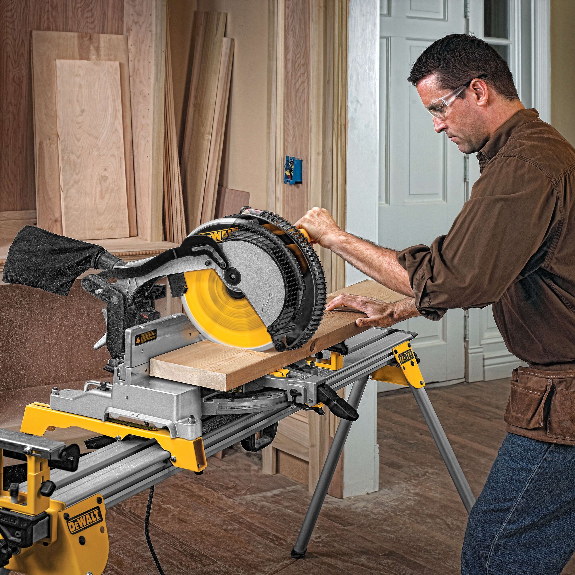 12 Inch Miter Saw Blade being used to slice a wooden plank by a person.